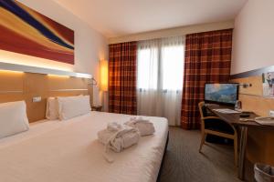 Letto o letti in una camera di Best Western Palace Inn Hotel