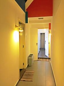 an empty hallway with a toilet in a room at Campbell Inn in Singapore