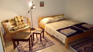 Posteľ alebo postele v izbe v ubytovaní Apartmani ZP44