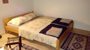 Posteľ alebo postele v izbe v ubytovaní Apartmani ZP44
