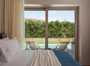 Voodi või voodid majutusasutuse Azure Resort & Spa toas