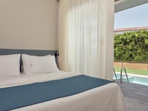 Voodi või voodid majutusasutuse Azure Resort & Spa toas