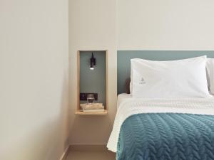 Voodi või voodid majutusasutuse Azure Resort & Spa toas