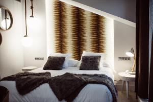 Cama o camas de una habitación en Hotel Cuevas - Adults Only