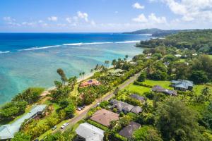 an aerial view of a beach with houses and the ocean at Anini Ohana Hale TVNC#4255 in Kilauea +20 photos