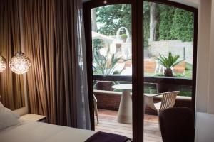 Hotel Cuevas - Adults Only客房内的一张或多张床位