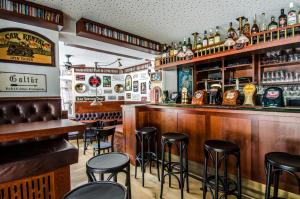 a bar with black stools in a restaurant at Apart Chamins in Ischgl