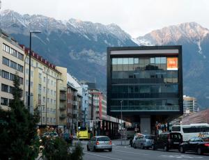 a city street filled with lots of traffic at ibis Innsbruck in Innsbruck