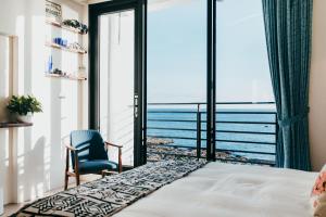 Ένα ή περισσότερα κρεβάτια σε δωμάτιο στο Chuanfanrock Haku Beach Days Inn