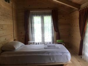 A bed or beds in a room at Aden River