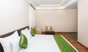 Treebo Durga Boji Grand, Gonikoppal Town客房内的一张或多张床位