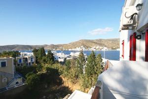 a view of a city from a balcony of a building at Anna Studios in Katapola