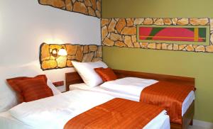 Letto o letti in una camera di Hotel Vinopa
