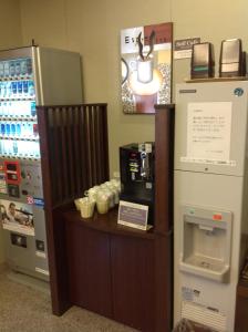 a coffee shop with a cash register and a refrigerator at Hotel Route-Inn Nagoya Sakae in Nagoya