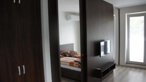 Postel nebo postele na pokoji v ubytování Apartmany pri lese
