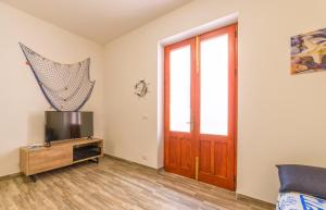 TV a/nebo společenská místnost v ubytování Al Mare