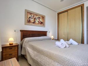 Łóżko lub łóżka w pokoju w obiekcie Ribera Beach 3 - 2706
