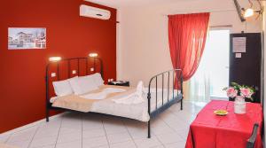 A bed or beds in a room at Panagiotis Hotel