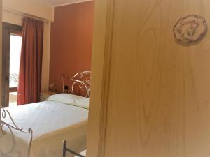 A bed or beds in a room at La Torre