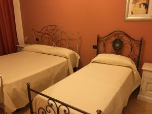 A bed or beds in a room at La Torre