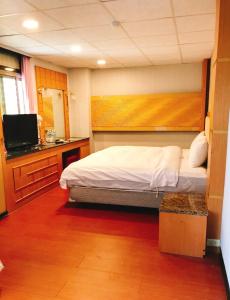 TV a/nebo společenská místnost v ubytování Chang Ti Metropolis Commercial Hotel