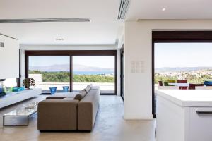 a living room with a couch and a table at Elea Villa Kissamos in Kissamos