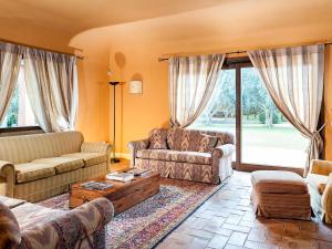 a living room with couches and a coffee table at Belvilla by OYO Villa Arangea Dieci in Marsala