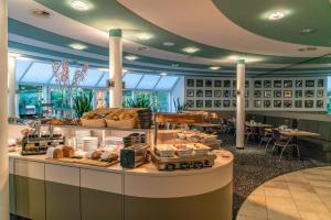 a buffet table with many different types of food at Globana Airport Hotel in Schkeuditz