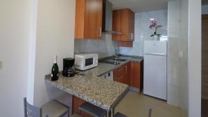 Kuchnia lub aneks kuchenny w obiekcie As Apartamentos Turisticos