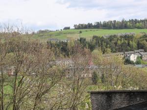 a view of a town with houses on a hill at The Button Box in Huddersfield
