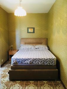Ein Bett oder Betten in einem Zimmer der Unterkunft Apartmani Slavonija