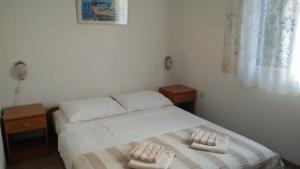 Posteľ alebo postele v izbe v ubytovaní Family apartments Grguric