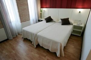 Postel nebo postele na pokoji v ubytování Hotel La Bastida