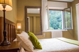 Postel nebo postele na pokoji v ubytování Hotel del Alto Sella