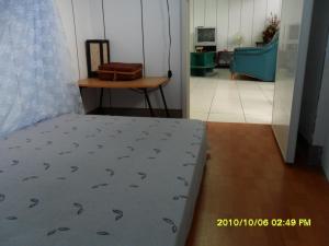 Letto o letti in una camera di Ku Shan Yuan Hotel