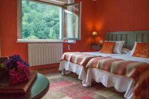 Postel nebo postele na pokoji v ubytování Hotel del Alto Sella