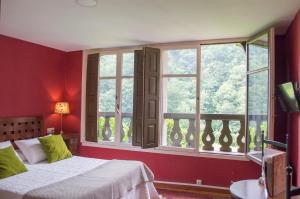 Postel nebo postele na pokoji v ubytování Hotel del Alto Sella