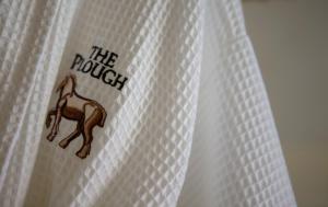 a white shower curtain with a camel on it at The Plough, Scalby in Scarborough