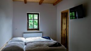 Letto o letti in una camera di Chata Bramberk