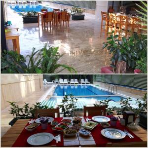 a table with plates of food next to a swimming pool at Elit Apart Otel in Konaklı