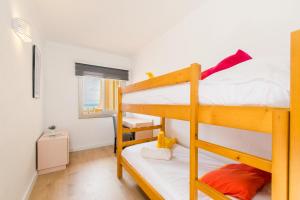 a bedroom with two bunk beds in a room at Apartamento SALZES IV in Alcudia