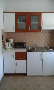 Kuchyň nebo kuchyňský kout v ubytování Apartment Mara