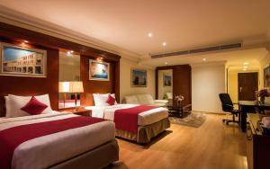 Una cama o camas en una habitación de Best Western Plus Doha