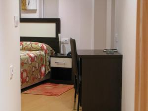 Posteľ alebo postele v izbe v ubytovaní Hotel Elizalde