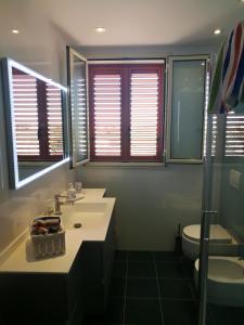 Kúpeľňa v ubytovaní casa vacanze Thea