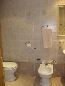 a bathroom with a toilet and a sink at Apartment Alea in Portorož
