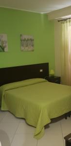 A bed or beds in a room at Essenza del Tempo