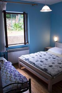 Llit o llits en una habitació de Guest house Ivo