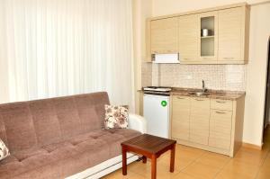 A kitchen or kitchenette at Magi Apart Hotel