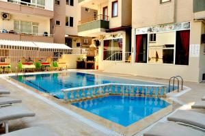 The swimming pool at or close to Magi Apart Hotel